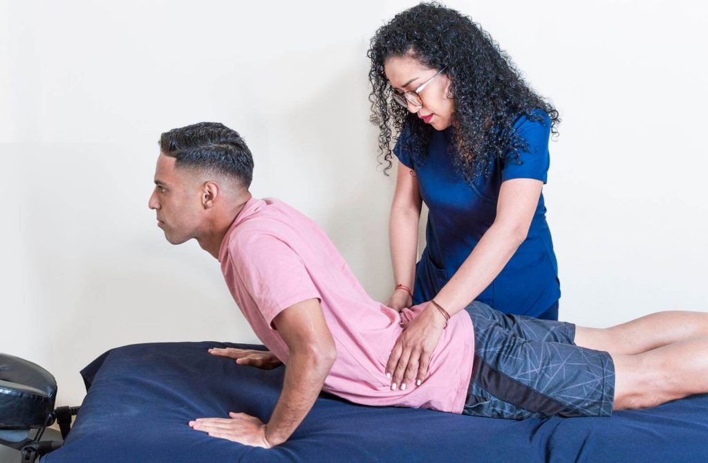 lower back physiotherapy physiotherapy treatment concept physiotherapist with patient