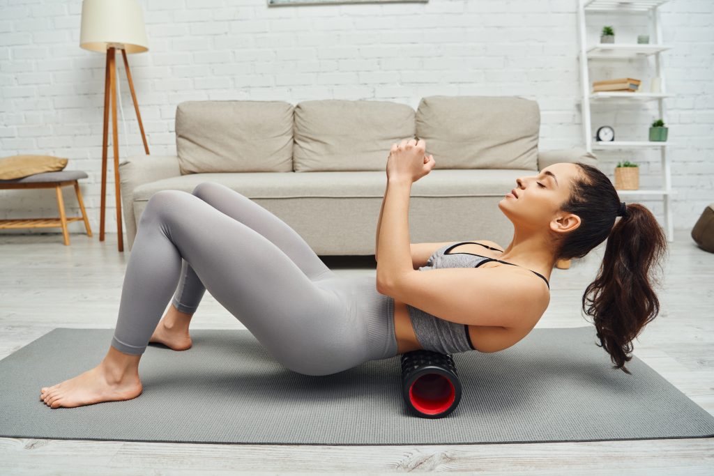 vistacreate 661662448 stock photo side view relaxed young woman activewear massaging small back modern