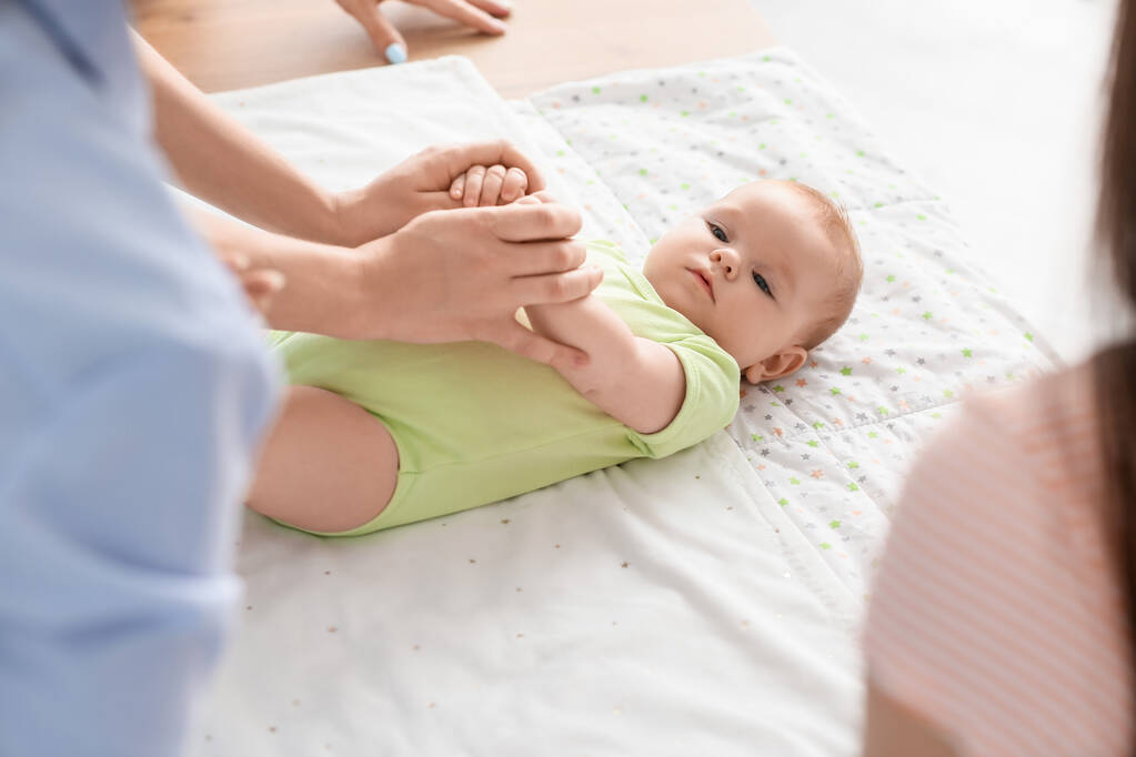 female speaker teaching expectant mothers how swaddle baby course closeup